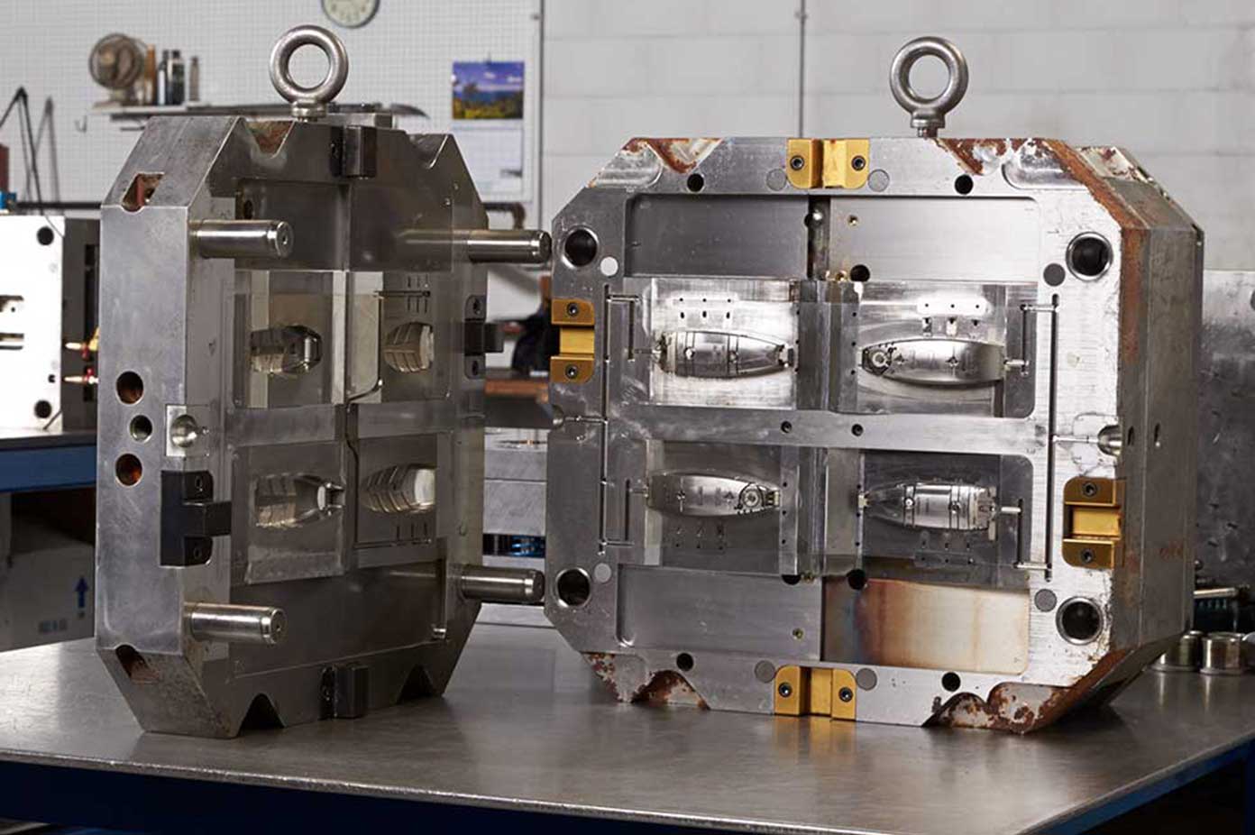 Open multi-cavity injection mould showing core and cavity halves